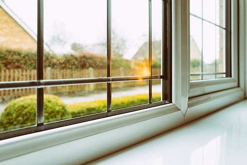 shallow focus of some rain droplets seen on a newly installed, double glazed leaded windows.